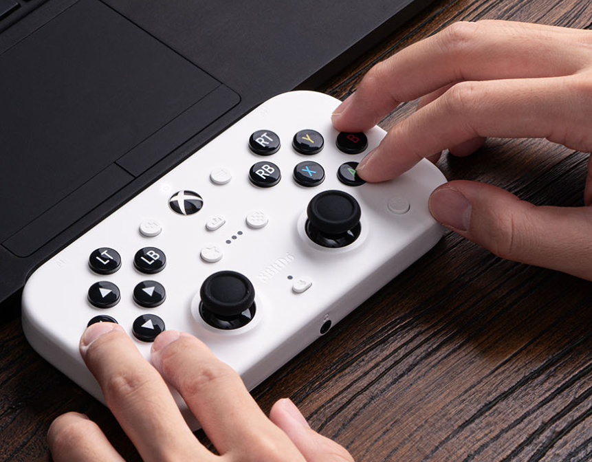 Top-down view of the 8BitDo Lite SE 2g showing the face-mounted triggers and joysticks.