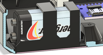 The battery cover with a 9V battery installed into the open playback recorder.